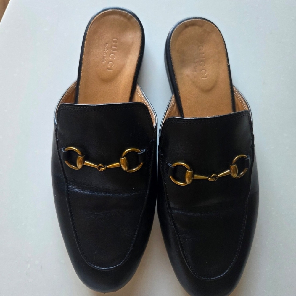 Gucci Black Leather Mules with Gold Detailing